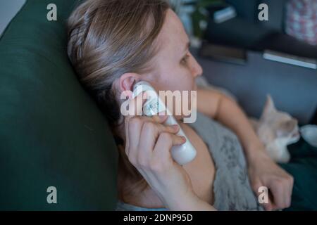 Woman checking temperature Stock Photo