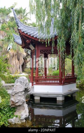 Chinese Kiosk or Oriental Garden Kiosk Framed by Weeping Willow in the Chinese Garden Borely Park Marseille Provence France Stock Photo
