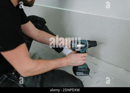 Man using electric drill Stock Photo