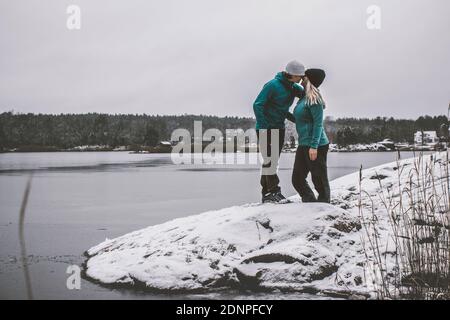 Couple kissing at sea Stock Photo