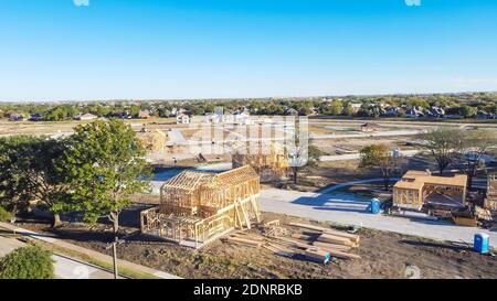 Aerial view wooden houses under construction in master planned community suburbs Dallas, Texas, America. Typical two story single family home on slab Stock Photo