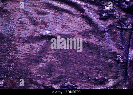 fabric texture of purple sequins with hologram liter. Hologram Foil Aesthetic. Trendy vaporwave shiny gradient Stock Photo