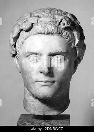 Marble bust of a man. Culture: Roman. Dimensions: H. 7 3/4 in. (19.7 cm).  Date: 3rd century A.D.. Beardless man with cloak on left shoulder. The  barely articulated hairstyle is divided into