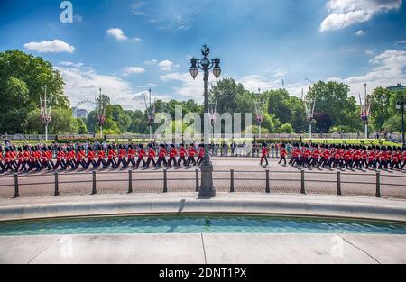 London, UK. 25th May 2019. Guardsmen march past The Queen Victoria Memorial to the Major Generals Review of Trooping the Colour at Horse Guards Parade