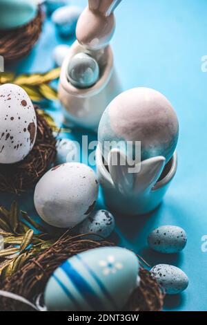 Easter bunny and Painted Easter eggs in bird's nests Stock Photo