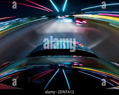 Car driving along a motorway at night, USA Stock Photo