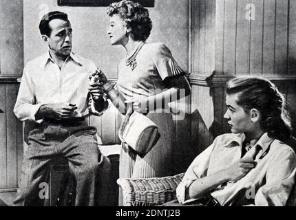 Film still from 'Key Largo' starring Lauren Bacall, Humphrey Bogart, Edward G. Robinson, and Claire Trevor.