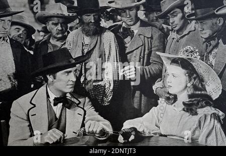 Film still from 'Can't Help Singing' starring Deanna Durbin, Akim Tamiroff; Leonid Kinskey, and Ray Collins. Stock Photo