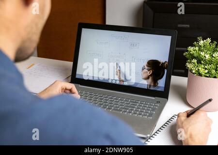remote learning distance education - business teacher streaming online lesson for student via laptop computer at home Stock Photo
