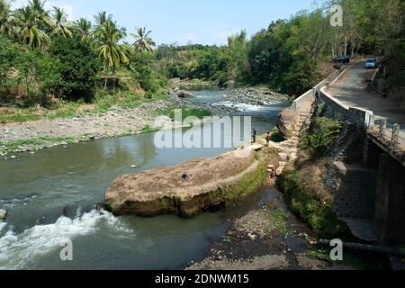 Residents in Taman Krocok village, Bondowoso, use the river for bathing and for playing. Stock Photo