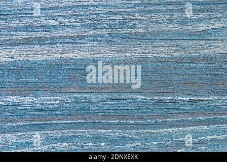 Bluish texture of weathered wooden wall with peeling old paint and cracks Stock Photo