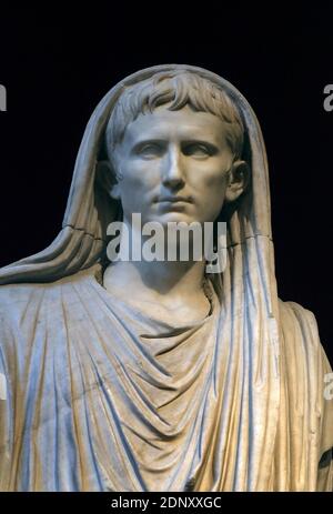 Rome, Italy. 18th Dec, 2020. Statue of Roman Emperor Augustus wearing the toga.(National Roman Museum - Palazzo Massimo alle Terme, Rome, Italy) - The Mausoleum of first Roman Emperor Augustus in Rome, Italy on December 18, 2020. Closed for the last 14 years, it will reopen finally in Spring 2021. Although this is the largest circular funerary monument in the Roman world, it was left in a ruinous condition for decades. It has been closed to the public for much of the last 80 years, with access stopped completely in 2007. Credit: ABACAPRESS/Alamy Live News Stock Photo