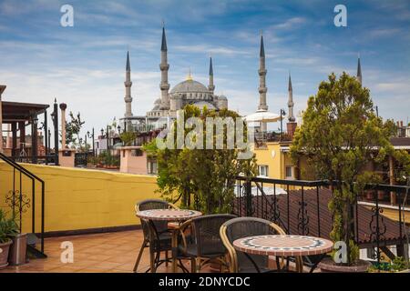 Turkey, Istanbul, View of Green Hotel rooftop tererace and Blue Mosque Stock Photo