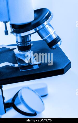 Closeup lens of a modern scientific microscope in the laboratory. Selective focus Stock Photo