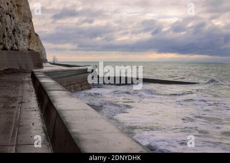 High tide along the undercliff walk and sea wall between Telscombe and Peacehaven on the East Sussex coast south east England Stock Photo