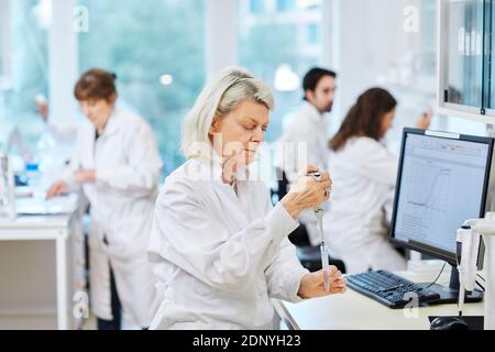 Woman working in laboratory Stock Photo