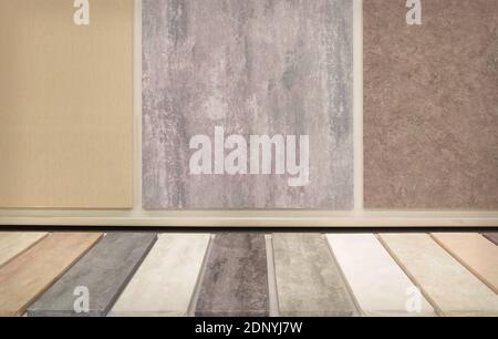 Room interior with colorful wooden planks on the floor and colored concrete wall Stock Photo