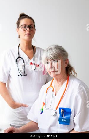 Two female doctors looking at camera Stock Photo