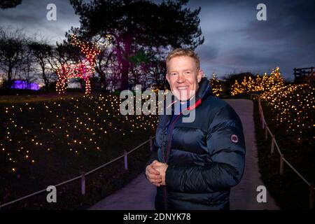 UK, Gloucestershire, Temple Guiting, Cotswold Farm Park, BBC Countryfile presenter and farmer Adam Henson in Enchanted Light Trail Stock Photo