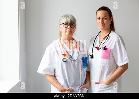 Two female doctors looking at camera Stock Photo