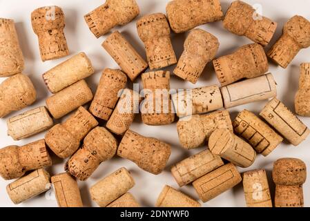 wine used corks scattered randomly on white background with top view, close up full frame Stock Photo