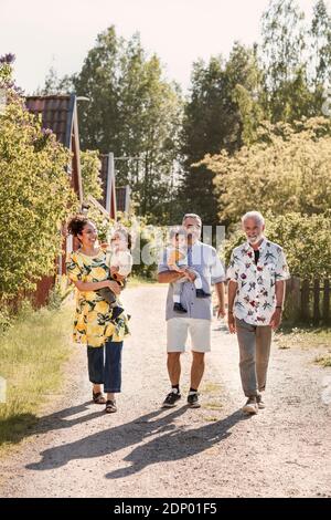 Three generation family walking together Stock Photo