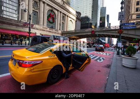 New York, USA - December 10, 2019. Street view and traffic with Grand Central Terminal Pershing Square Plaza during winter holidays in Manhattan. Stock Photo