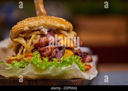 delicious burger with double cutlet on a wooden board Stock Photo