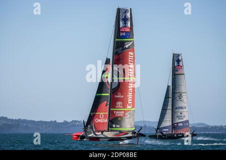 American Magic helmed by Dean Barker and Emirates Team New Zealand helmed by Peter Burling during Official practice ahead of th / LM Stock Photo