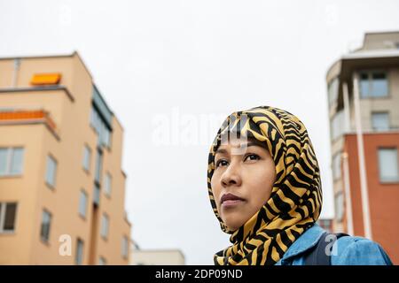 Woman wearing hijab looking away Stock Photo