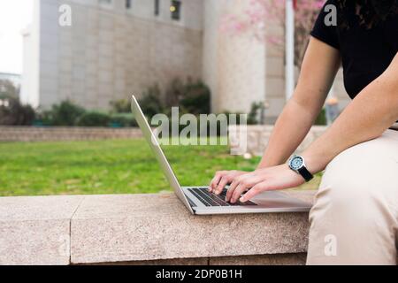 Womans hands using laptop Stock Photo
