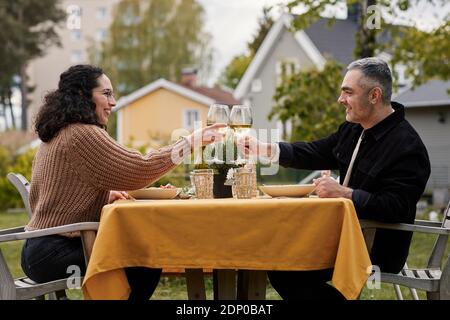 Couple having meal in garden Stock Photo
