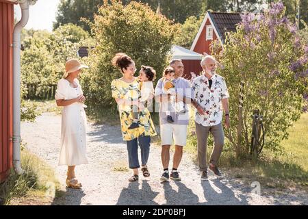 Three generation family walking together Stock Photo