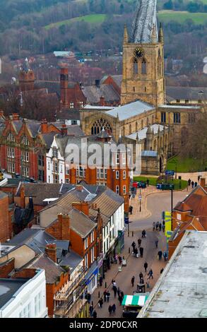 View of the crooked spire church and Burlington Street a pedestrianised shopping street in Chesterfield town centre in Derbyshire England UK Stock Photo