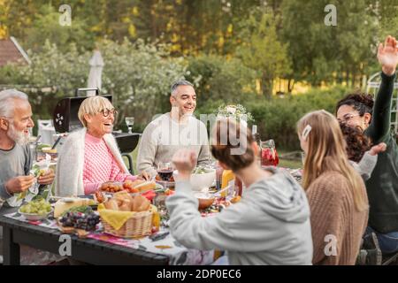 Family having meal in garden Stock Photo