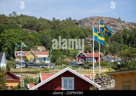 Swedish flags and houses at summer Stock Photo