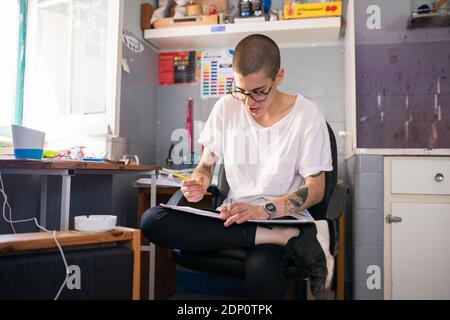 Female designer working in office Stock Photo
