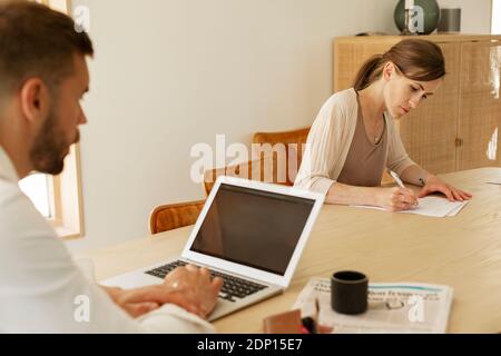 Couple working from home Stock Photo