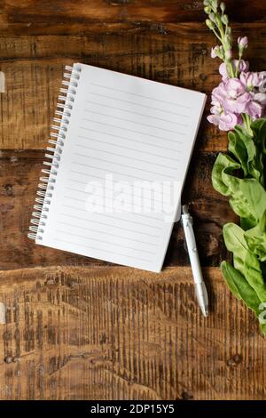 Open notebook on wooden background Stock Photo