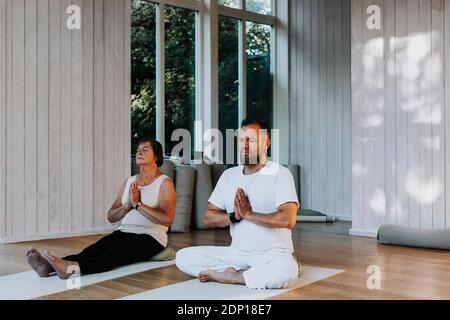 People practicing yoga in class Stock Photo