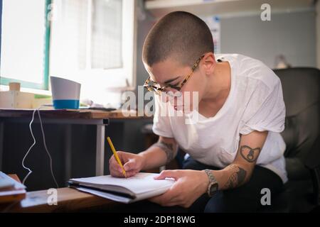 Female designer working in office Stock Photo