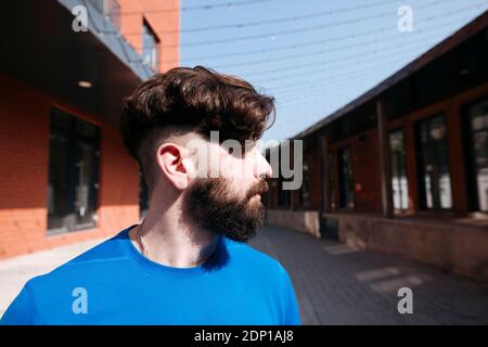 Portraot of young man walking in the city Stock Photo