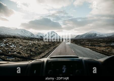 UK, Scotland, Glencoe, empty road seen through car windscreen Stock Photo