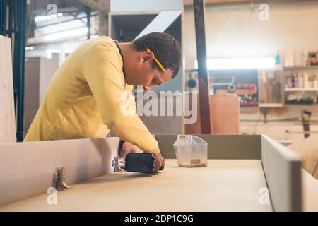 Carpenter working in workshop Stock Photo