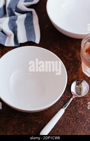 empty white soup plate with spoon Stock Photo