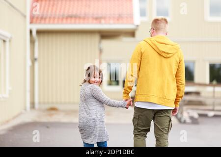 Father holding daughters hand Stock Photo
