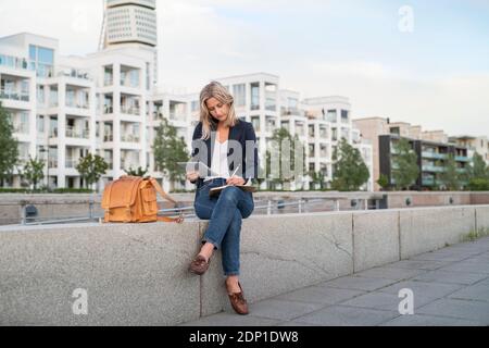 Woman using digital tablet Stock Photo