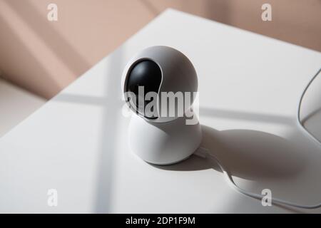 white video surveillance camera to monitor babies, children or areas of the house Stock Photo
