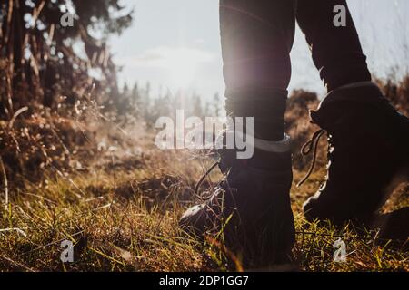 Low section of hiker wearing hiking boots Stock Photo