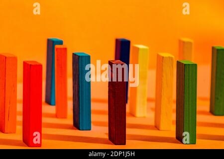 Colorful construction blocks on orange background Stock Photo